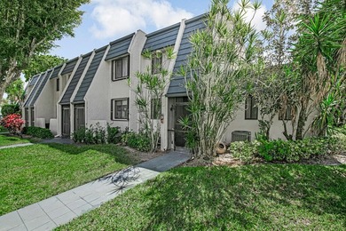 Beautiful and completely remodeled corner unit townhouse with on Fountains Golf and Country Club in Florida - for sale on GolfHomes.com, golf home, golf lot