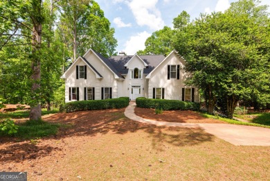 Perched on a slight slope overlooking the 11th fairway of the on Jennings Mill Country Club in Georgia - for sale on GolfHomes.com, golf home, golf lot