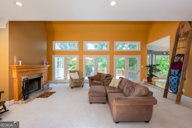 Perched on a slight slope overlooking the 11th fairway of the on Jennings Mill Country Club in Georgia - for sale on GolfHomes.com, golf home, golf lot