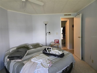 ZELLWOOD STATION 2 BEDROOM 2 BATH HOME located on a quiet on Zellwood Station Country Club in Florida - for sale on GolfHomes.com, golf home, golf lot