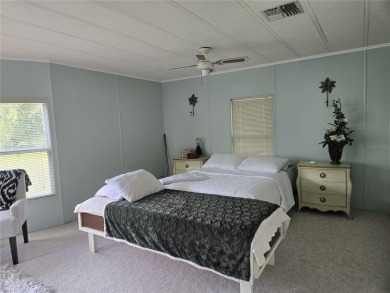 ZELLWOOD STATION 2 BEDROOM 2 BATH HOME located on a quiet on Zellwood Station Country Club in Florida - for sale on GolfHomes.com, golf home, golf lot