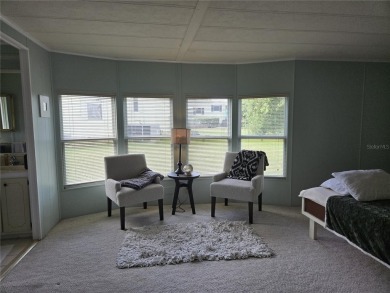 ZELLWOOD STATION 2 BEDROOM 2 BATH HOME located on a quiet on Zellwood Station Country Club in Florida - for sale on GolfHomes.com, golf home, golf lot