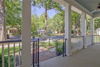 LAKEFRONT LIVING with over 180' of Lake Kedron views and on Canongate At Flat Creek Club in Georgia - for sale on GolfHomes.com, golf home, golf lot