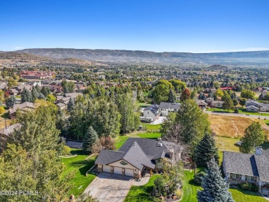 Embrace the vibrant beauty of spring and summer in this on Homestead Golf Club and Resort in Utah - for sale on GolfHomes.com, golf home, golf lot