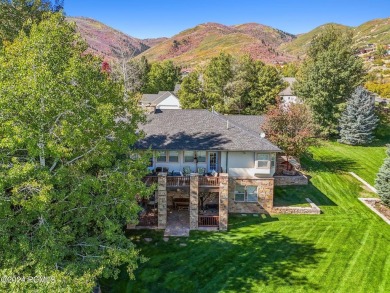 Embrace the vibrant beauty of spring and summer in this on Homestead Golf Club and Resort in Utah - for sale on GolfHomes.com, golf home, golf lot