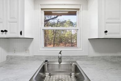 This charming, fully renovated 2-bed/1-bath townhome is ideal as on DeSoto Golf Course in Arkansas - for sale on GolfHomes.com, golf home, golf lot