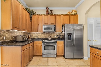 Welcome to this warm and inviting home nestled on a cul-de-sac on Royal Tee Country Club in Florida - for sale on GolfHomes.com, golf home, golf lot