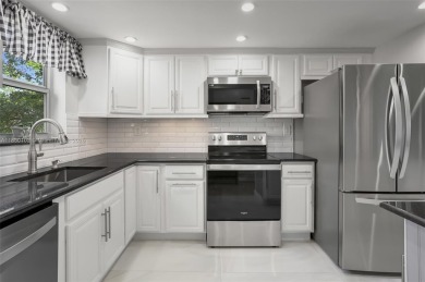 Gorgeous corner unit with stunning water views in strong condo on Inverrary Country Club in Florida - for sale on GolfHomes.com, golf home, golf lot