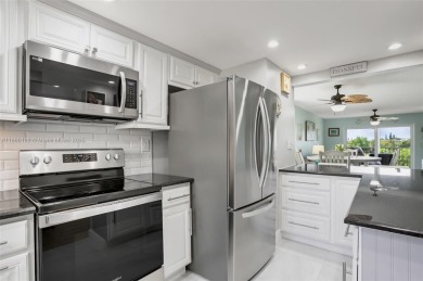 Gorgeous corner unit with stunning water views in strong condo on Inverrary Country Club in Florida - for sale on GolfHomes.com, golf home, golf lot