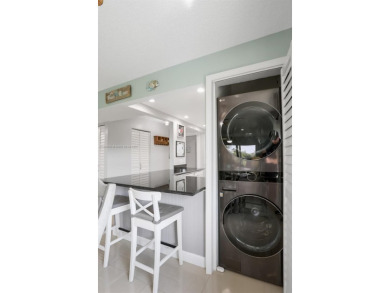Gorgeous corner unit with stunning water views in strong condo on Inverrary Country Club in Florida - for sale on GolfHomes.com, golf home, golf lot