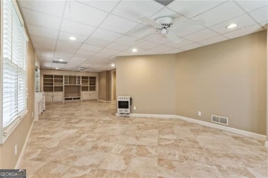 Nestled on a beautifully landscaped half-acre lot in on Chapel Hills Golf and Country Club in Georgia - for sale on GolfHomes.com, golf home, golf lot