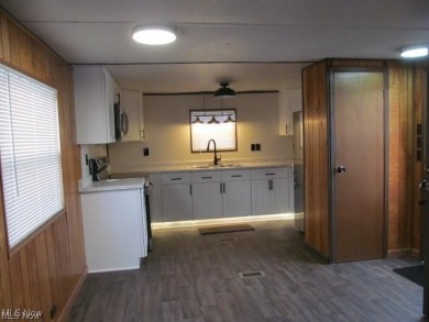 Welcome to this stunning 2 bedroom, 1 bath manufactured home on Erie Shores Golf Course in Ohio - for sale on GolfHomes.com, golf home, golf lot