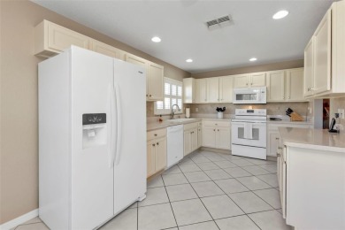NEAT AS A PIN Sheffield home on LARGE corner lot in the gated on Kings Gate Golf Club in Florida - for sale on GolfHomes.com, golf home, golf lot