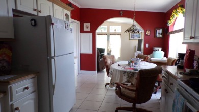 This charming three-bedroom Palm Harbor home offers an idyllic on Schalamar Creek Golf and Country Club in Florida - for sale on GolfHomes.com, golf home, golf lot