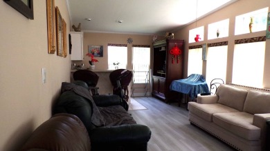 This charming three-bedroom Palm Harbor home offers an idyllic on Schalamar Creek Golf and Country Club in Florida - for sale on GolfHomes.com, golf home, golf lot