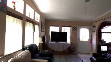 This charming three-bedroom Palm Harbor home offers an idyllic on Schalamar Creek Golf and Country Club in Florida - for sale on GolfHomes.com, golf home, golf lot
