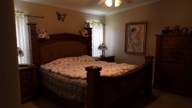 This charming three-bedroom Palm Harbor home offers an idyllic on Schalamar Creek Golf and Country Club in Florida - for sale on GolfHomes.com, golf home, golf lot