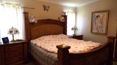 This charming three-bedroom Palm Harbor home offers an idyllic on Schalamar Creek Golf and Country Club in Florida - for sale on GolfHomes.com, golf home, golf lot