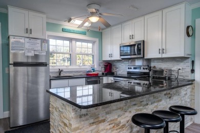 Meticulously maintained Edisto cottage fronting on a saltwater on The Plantation Course At Edisto in South Carolina - for sale on GolfHomes.com, golf home, golf lot