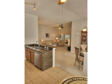 Welcome to this well-maintained 3-bedroom, 2-bathroom on Tampa Bay Golf and Country Club in Florida - for sale on GolfHomes.com, golf home, golf lot