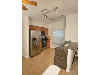Welcome to this well-maintained 3-bedroom, 2-bathroom on Tampa Bay Golf and Country Club in Florida - for sale on GolfHomes.com, golf home, golf lot