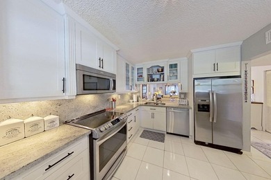 Welcome to this thoughtfully updated home on the second floor on Old Marsh Golf Club in Florida - for sale on GolfHomes.com, golf home, golf lot