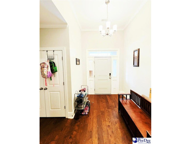 Experience peaceful luxury living at 309 Dormie Lane, located on The Members Club At Woodcreek in South Carolina - for sale on GolfHomes.com, golf home, golf lot