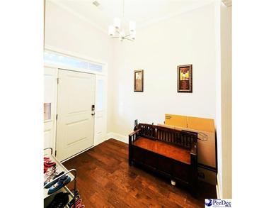 Experience peaceful luxury living at 309 Dormie Lane, located on The Members Club At Woodcreek in South Carolina - for sale on GolfHomes.com, golf home, golf lot