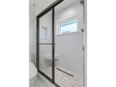 Walk one block to the beach! This stunning home has been on Beachview Golf Club in Florida - for sale on GolfHomes.com, golf home, golf lot