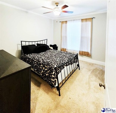 Experience peaceful luxury living at 309 Dormie Lane, located on The Members Club At Woodcreek in South Carolina - for sale on GolfHomes.com, golf home, golf lot