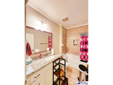 Experience peaceful luxury living at 309 Dormie Lane, located on The Members Club At Woodcreek in South Carolina - for sale on GolfHomes.com, golf home, golf lot