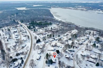 Cozy up to the crackle of the real wood fireplace in this home on Lake McBride Golf Course in Iowa - for sale on GolfHomes.com, golf home, golf lot