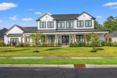 Set behind the gates of Cypress River Plantation, this modern on Heron Point Golf Club in South Carolina - for sale on GolfHomes.com, golf home, golf lot