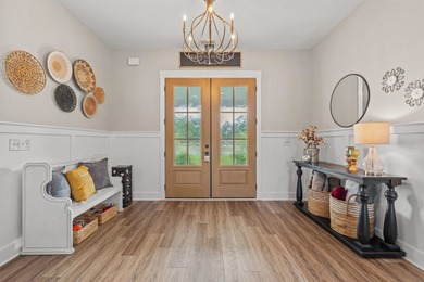 Set behind the gates of Cypress River Plantation, this modern on Heron Point Golf Club in South Carolina - for sale on GolfHomes.com, golf home, golf lot