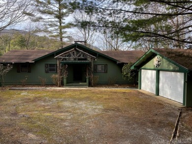 Charming 3 bedroom, 4 bath home on the 18th fairway in Lake on Lake Toxaway Country Club in North Carolina - for sale on GolfHomes.com, golf home, golf lot