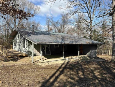 Cute holiday style cabin with end of the road privacy. Level lot on The Course At Turkey Mountain in Arkansas - for sale on GolfHomes.com, golf home, golf lot