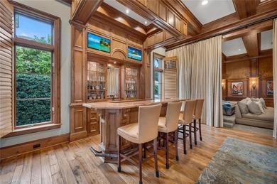 From the moment you enter, this home's expansive windows on Grey Oaks Golf and Country Club in Florida - for sale on GolfHomes.com, golf home, golf lot