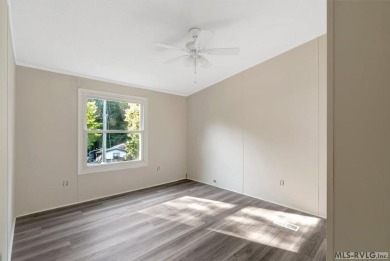 This spacious doublewide offers new  laminate flooring and on River Ridge Golf Club in Virginia - for sale on GolfHomes.com, golf home, golf lot