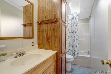 This spacious doublewide offers new  laminate flooring and on River Ridge Golf Club in Virginia - for sale on GolfHomes.com, golf home, golf lot