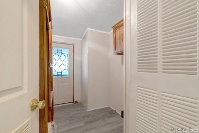 This spacious doublewide offers new  laminate flooring and on River Ridge Golf Club in Virginia - for sale on GolfHomes.com, golf home, golf lot