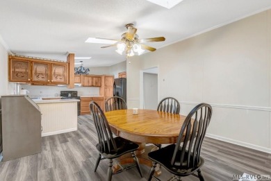 This spacious doublewide offers new  laminate flooring and on River Ridge Golf Club in Virginia - for sale on GolfHomes.com, golf home, golf lot