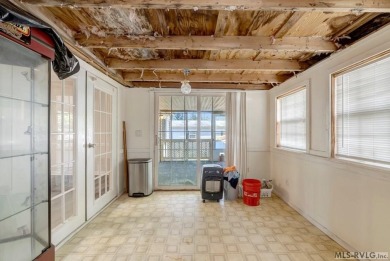 This spacious doublewide offers new  laminate flooring and on River Ridge Golf Club in Virginia - for sale on GolfHomes.com, golf home, golf lot