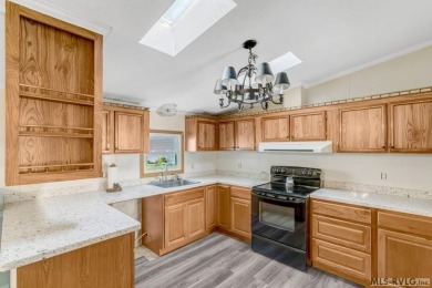 This spacious doublewide offers new  laminate flooring and on River Ridge Golf Club in Virginia - for sale on GolfHomes.com, golf home, golf lot