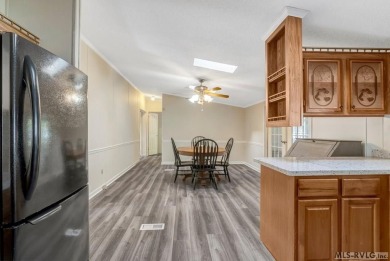 This spacious doublewide offers new  laminate flooring and on River Ridge Golf Club in Virginia - for sale on GolfHomes.com, golf home, golf lot