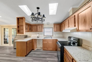 This spacious doublewide offers new  laminate flooring and on River Ridge Golf Club in Virginia - for sale on GolfHomes.com, golf home, golf lot