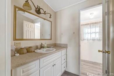 This spacious doublewide offers new  laminate flooring and on River Ridge Golf Club in Virginia - for sale on GolfHomes.com, golf home, golf lot