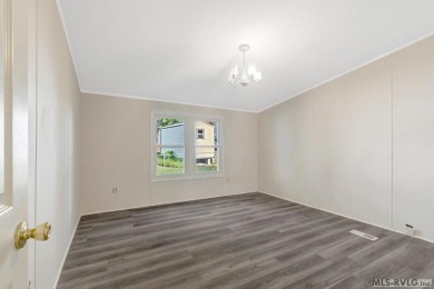This spacious doublewide offers new  laminate flooring and on River Ridge Golf Club in Virginia - for sale on GolfHomes.com, golf home, golf lot