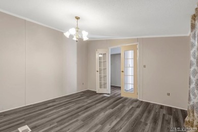 This spacious doublewide offers new  laminate flooring and on River Ridge Golf Club in Virginia - for sale on GolfHomes.com, golf home, golf lot