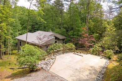 Discover a captivating retreat in Holly Forest with this classic on Sapphire National Golf Club in North Carolina - for sale on GolfHomes.com, golf home, golf lot