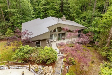 Discover a captivating retreat in Holly Forest with this classic on Sapphire National Golf Club in North Carolina - for sale on GolfHomes.com, golf home, golf lot